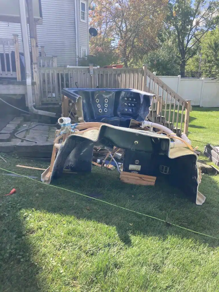 A hot tub cut in half, prepared for removal by 24-7JUNK.COM's hot tub removal service in Mount Prospect, IL.