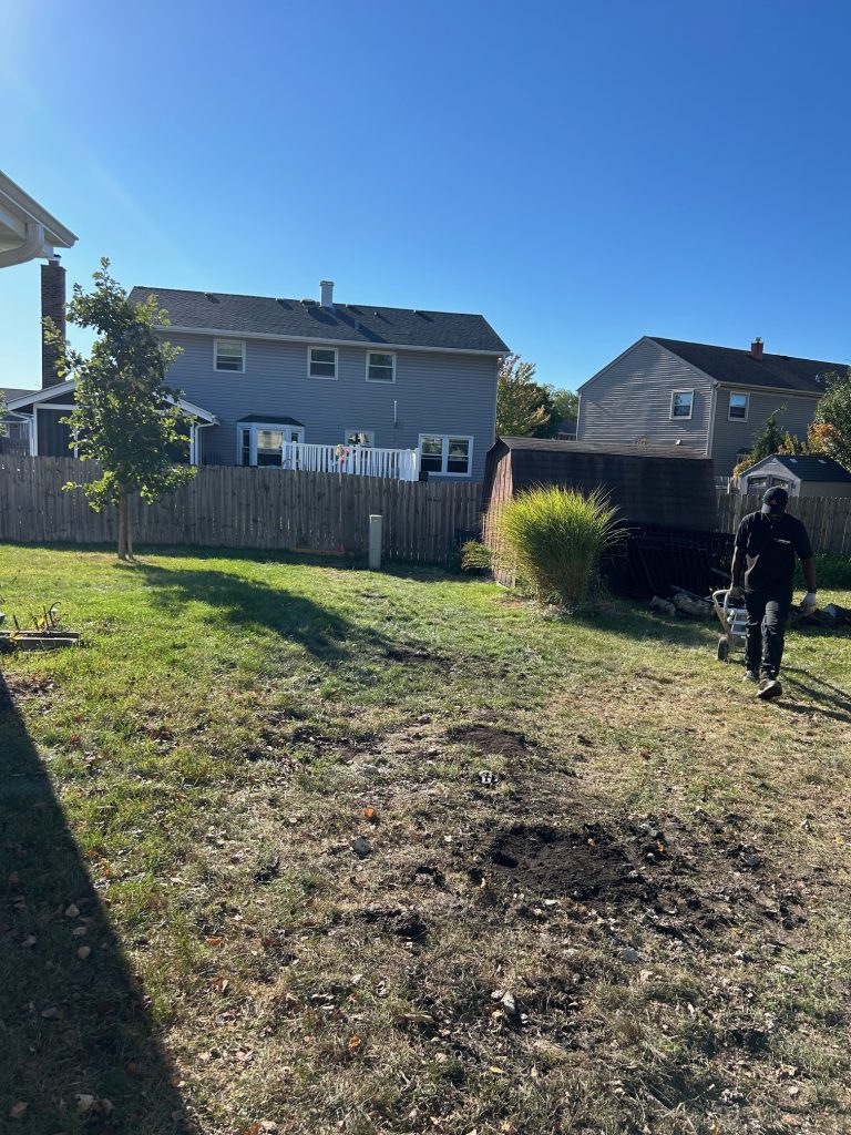24-7JUNK.COM Team Member Cleaning Up After Completing Junk Removal Barrington IL Job.